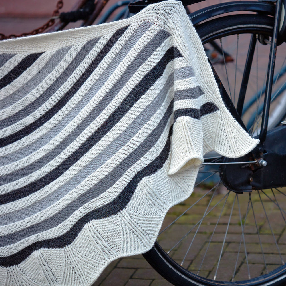 This image shows a detail of the Canal Ring from Westknits in contrasting grey and white tones. 