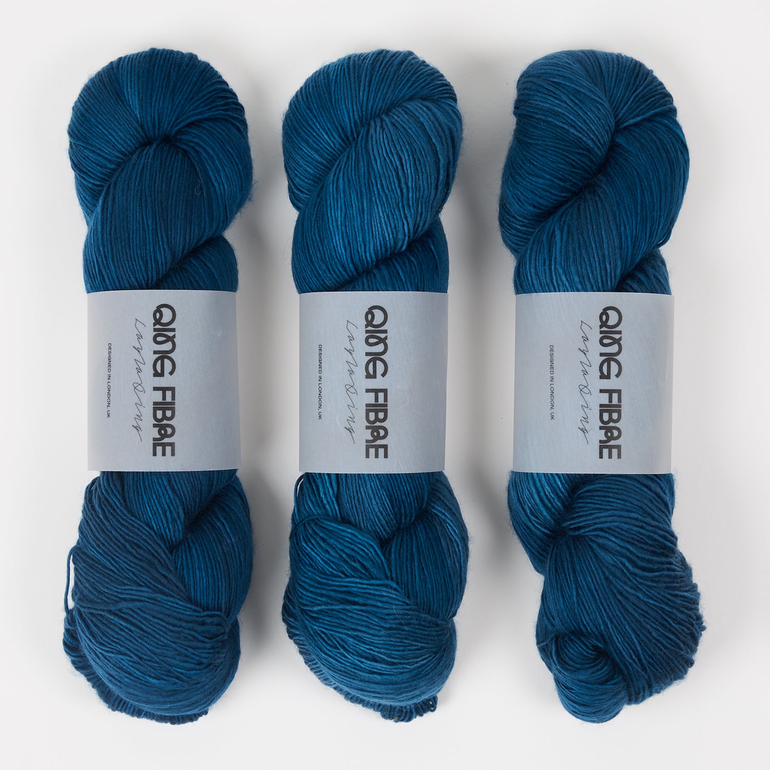 Qing Fibre DASHING SASSY - OKINAMI Merino wool Fingering blue Yarn