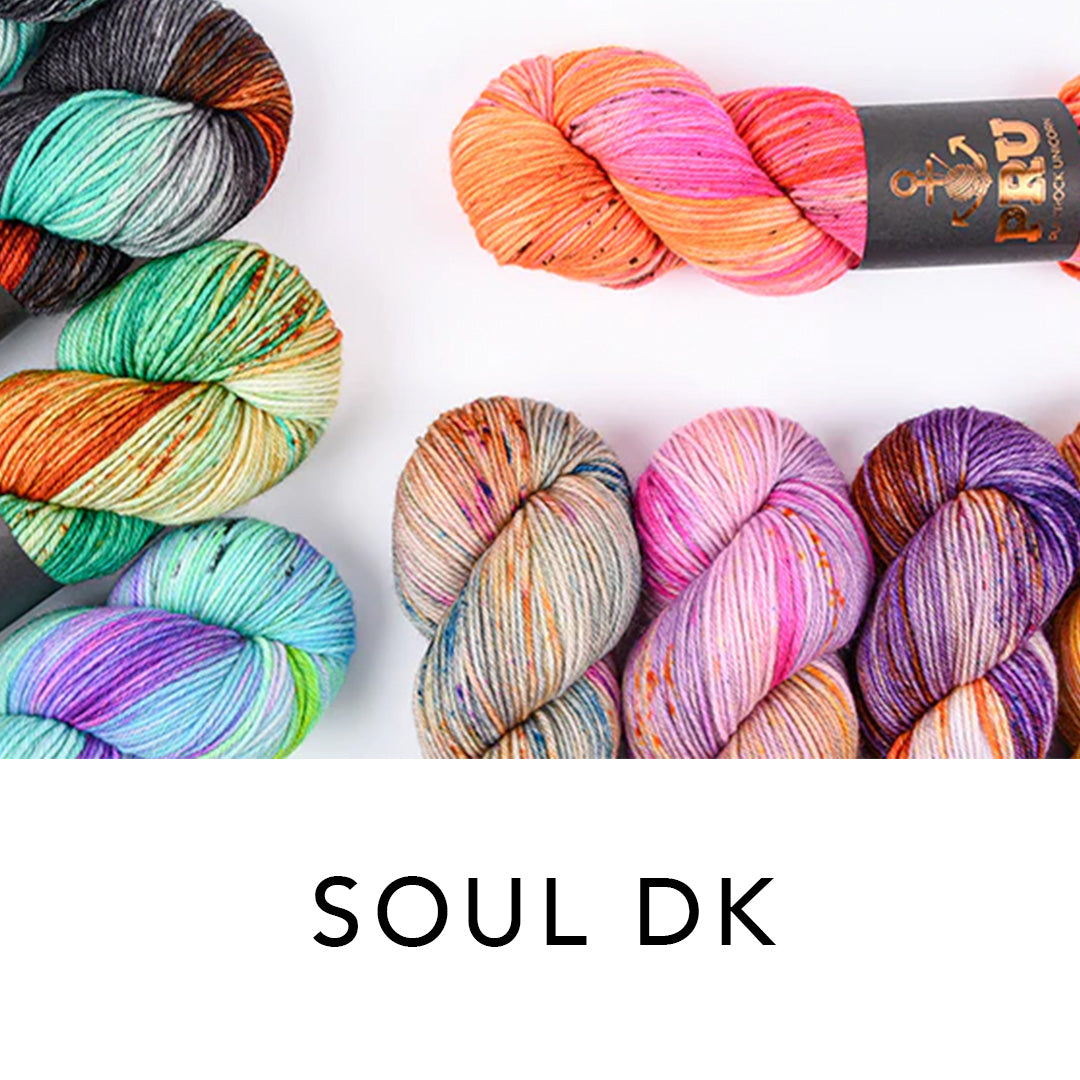 This image shows some skeins of Soul DK in PRU in various colours. 
