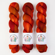 Twisted Ambitions SWEET SOCK - SUNSET Merino wool Nylon Fingering orange Yarn