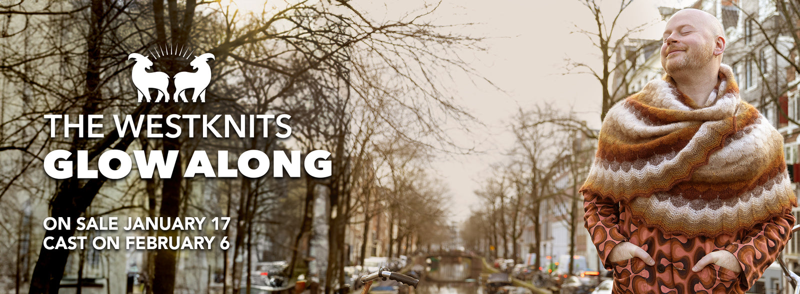 This image advertises "The Westknits Glow Along," with details about it going on sale January 17 and starting on February 6. It features Stephen West wearing a beautifully knitted shawl in warm, earthy tones. The background shows a tree-lined street, and the text includes a logo with the West Wool Glohair logo .