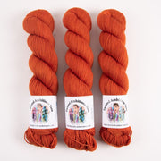 Twisted Ambitions SWEET SOCK - AMBER Merino wool Nylon Fingering orange Yarn
