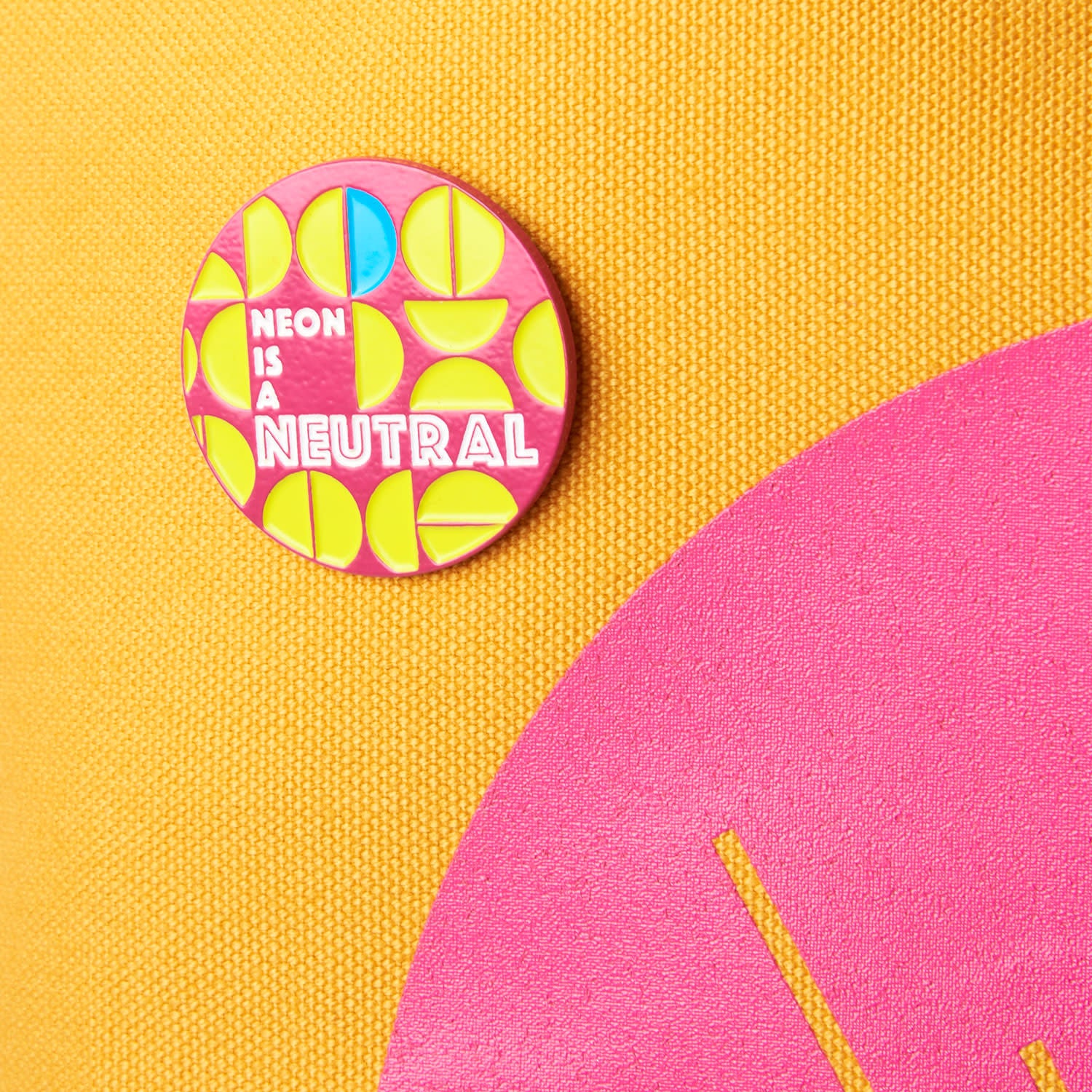 NEON IS A NEUTRAL ENAMEL PIN